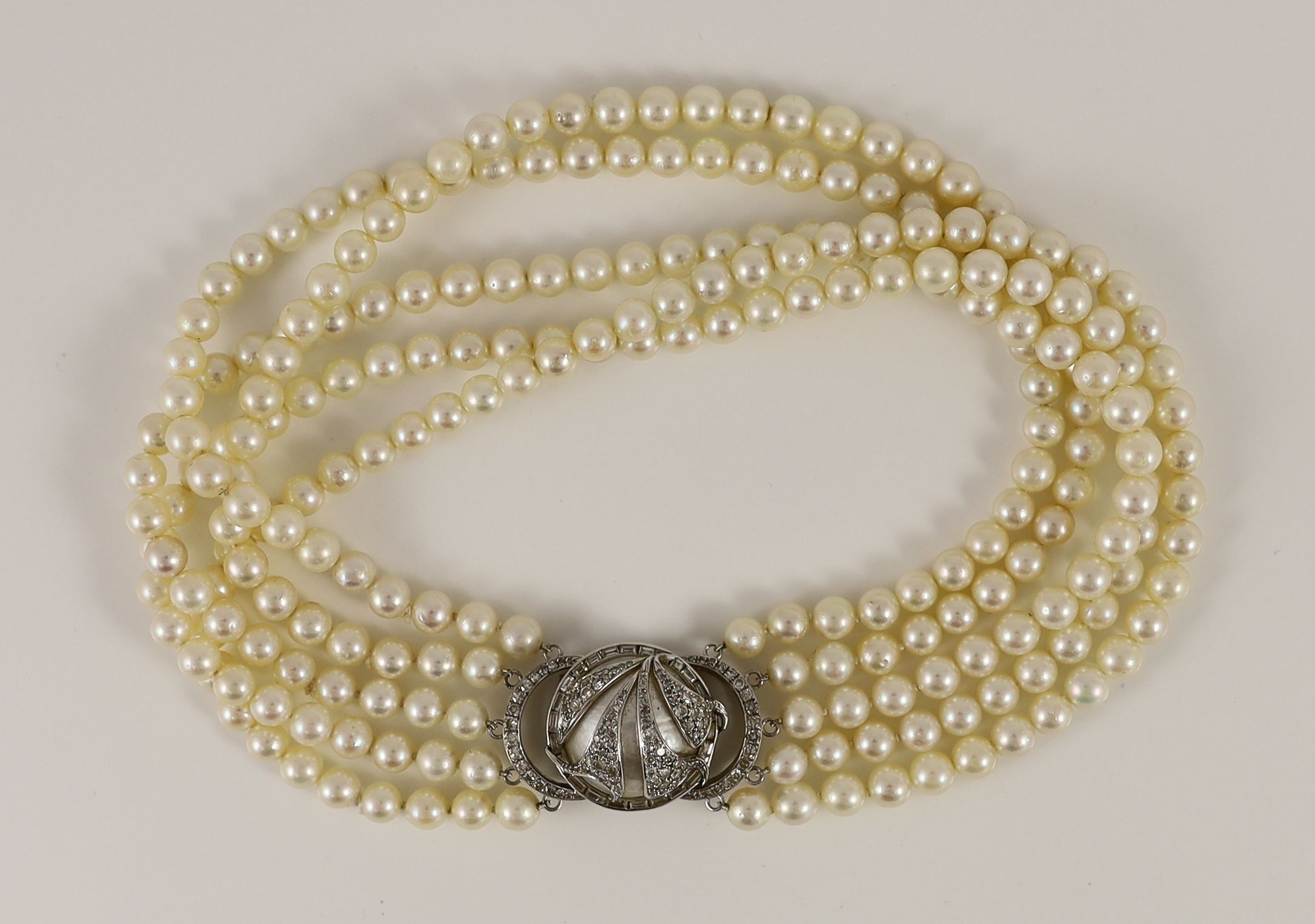 A 20th century quintuple strand cultured pearl choker necklace, with 14k, white gold and diamond set large mabe pearl clasp